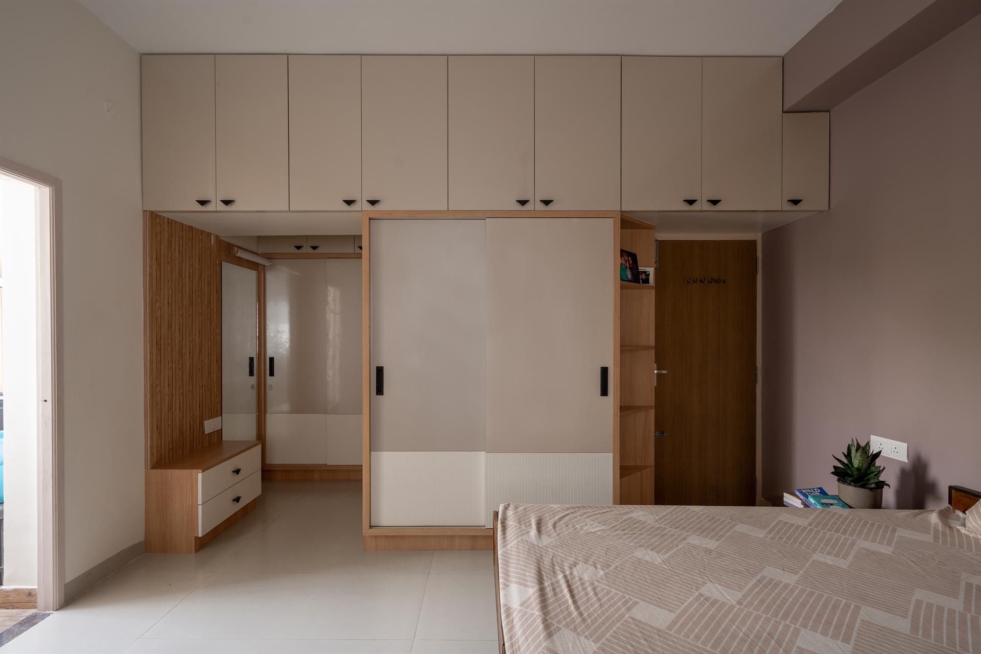 Bhagavatam — Kids room with blue cabinets