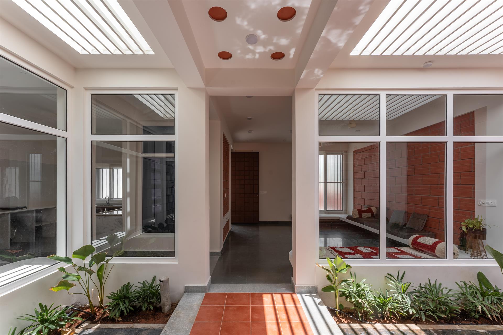 OXO House — Courtyard entrance with skylights and plants
