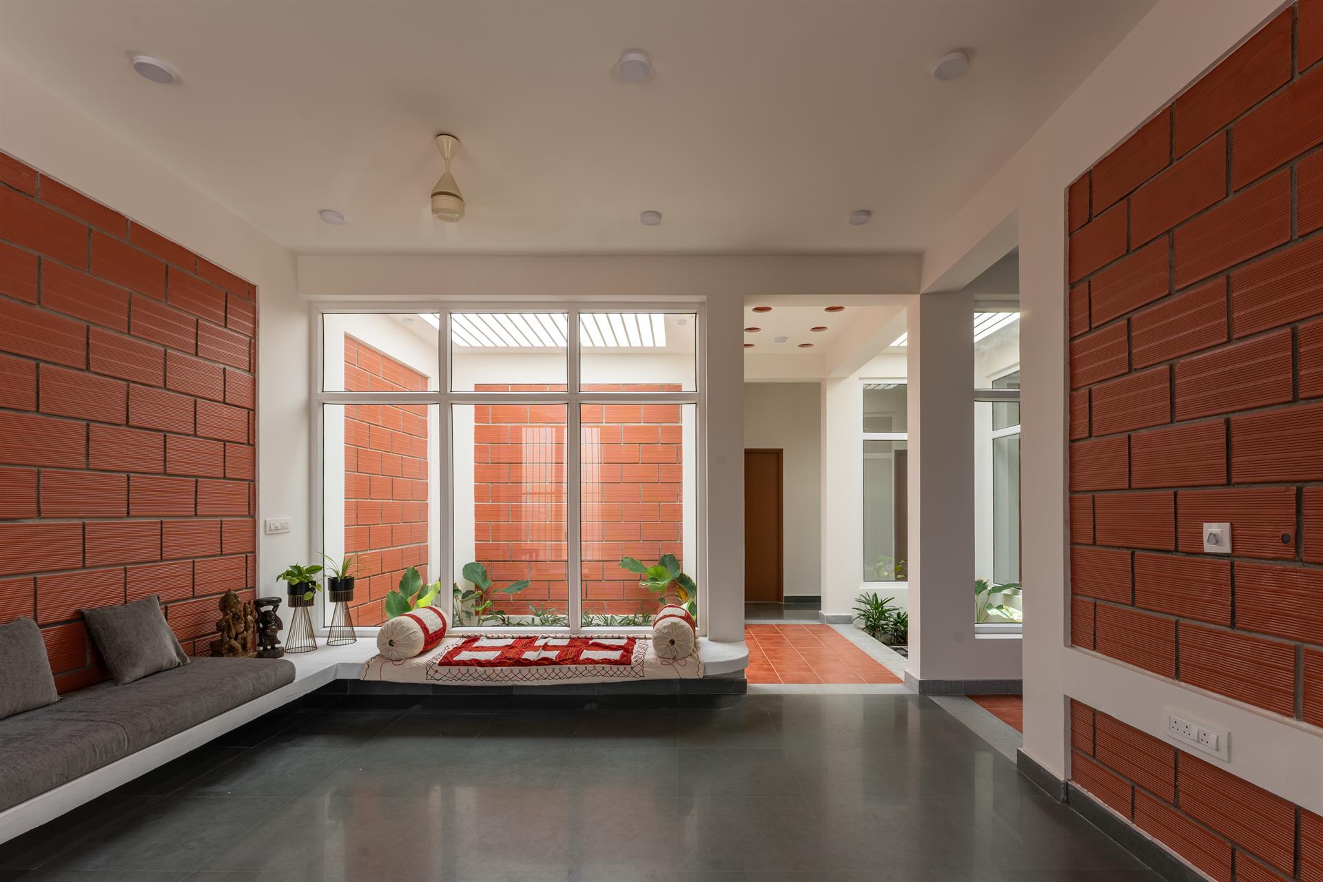 OXO House — Living area with exposed brick walls
